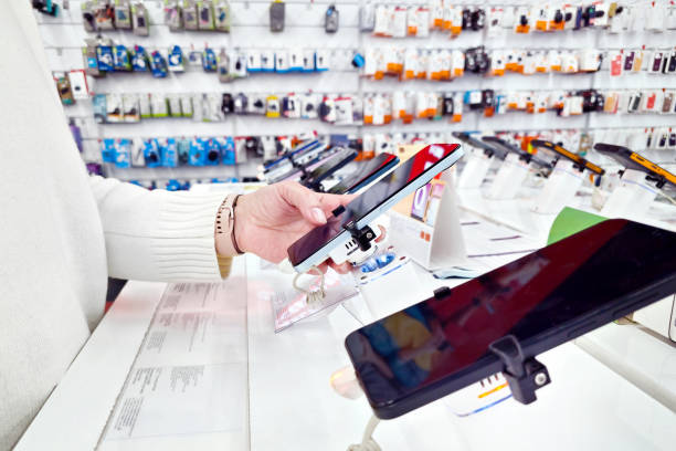 woman with phone in electronic store